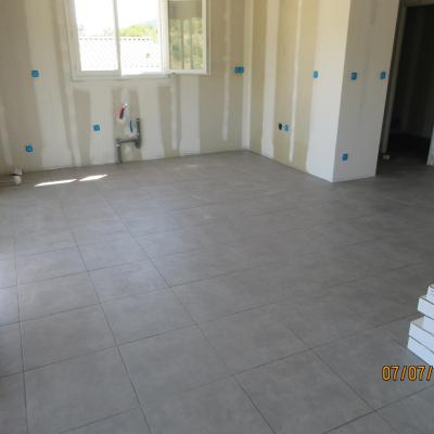 Pose du carrelage scellé sur chape maigre